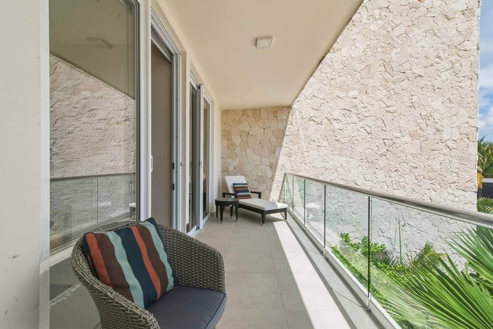 Step out onto your private balcony just off the living room and bedroom, featuring amazing views and outdoor furniture including a lounge chair—perfect for soaking in the view and the sea breeze.