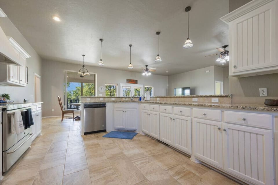 Large fully stocked kitchen.  Includes dishware, pots and pans, basic appliances, spices and cooking oil.