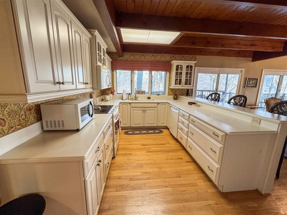 Well appointed, open Gourmet Kitchen lots of work and cabinet space with Bar seating