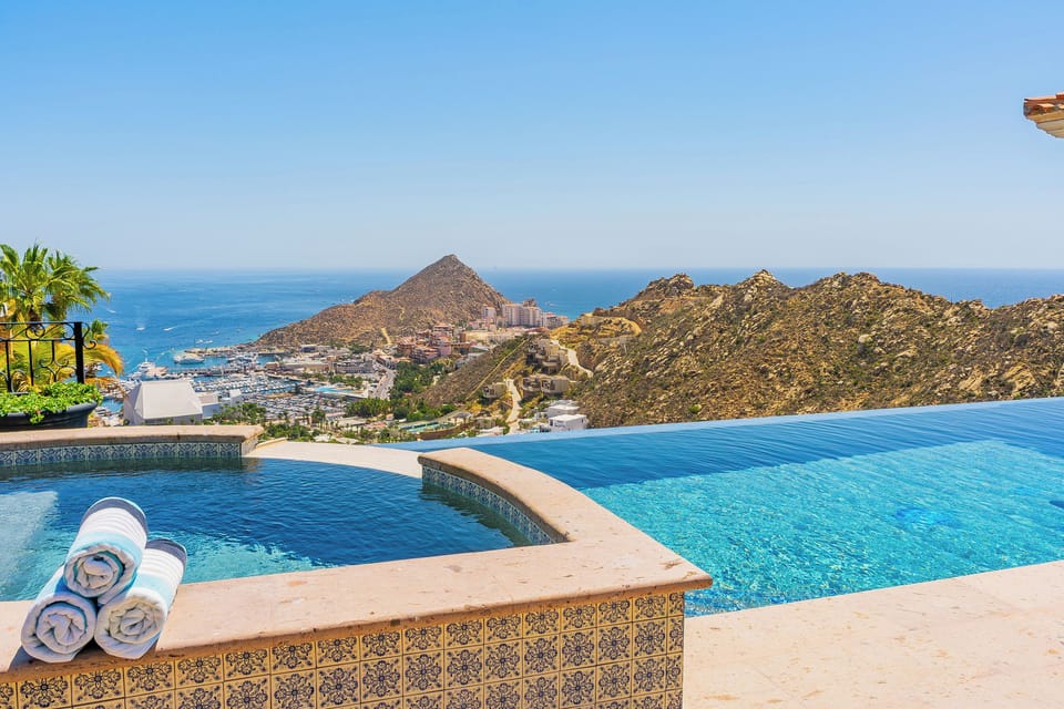 Dive into your private infinity pool while soaking up breathtaking ocean and mountain views that stretch endlessly before you.