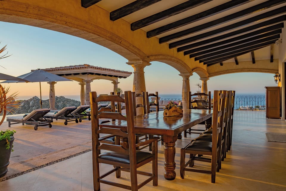 Enjoy memorable meals at this stunning covered terrace with sea views and elegant archways.