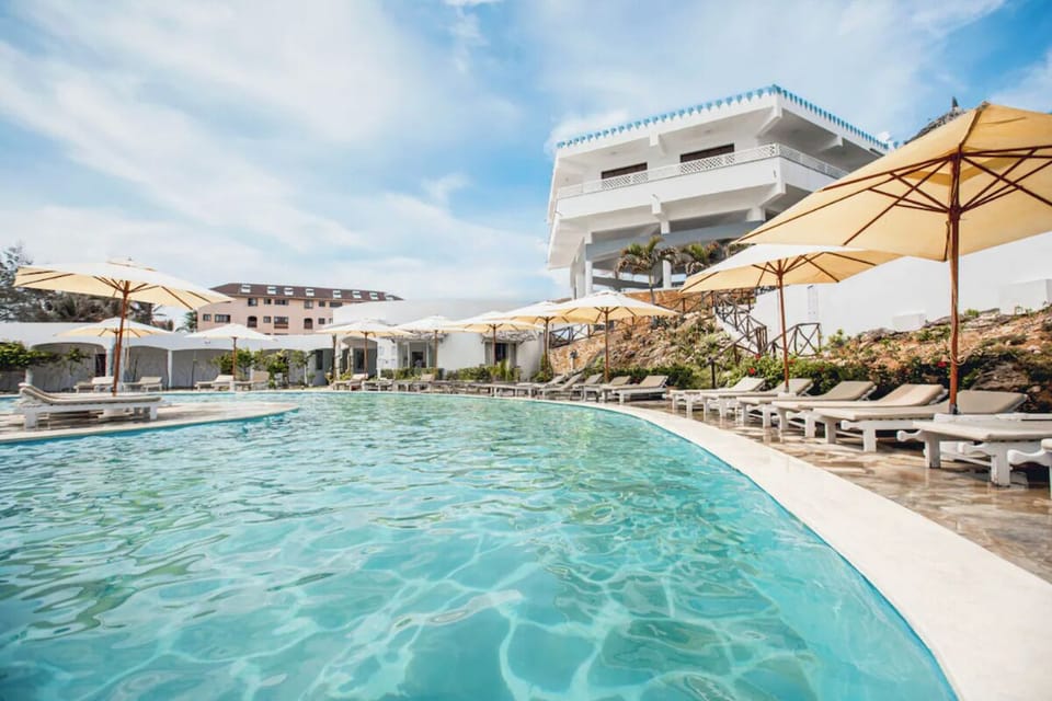 Soak up sunshine beside the sparkling pool and loungers
