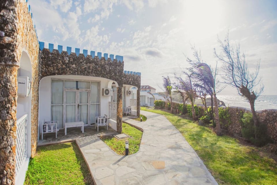 Stroll the sunlit path to waves and sea breezes.