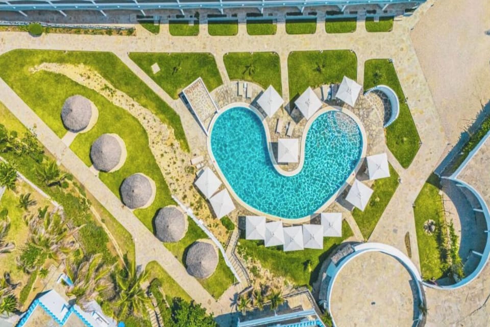 See the resort from above—pool days made effortlessly inviting.
