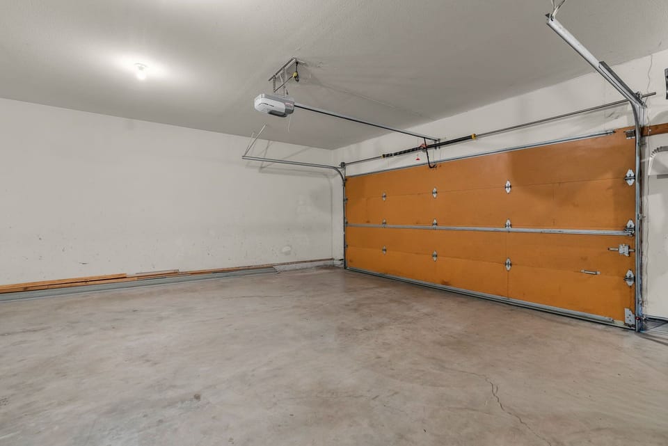 Spacious garage with automatic door system provides secure parking for your vehicle during your stay.