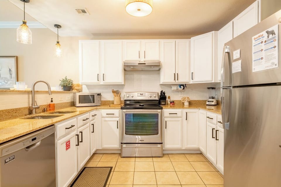 Your fully equipped kitchen features granite counters, stainless appliances, and everything needed to create memorable meals during your stay.