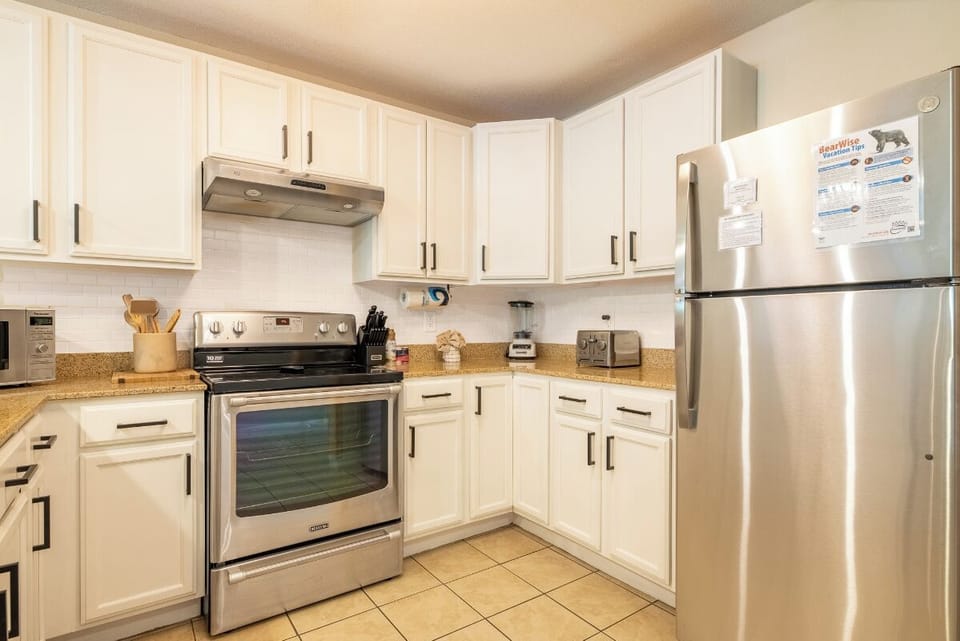 Your fully equipped kitchen awaits with stainless steel appliances, ample counter space, and everything you need to prepare delicious meals during your stay.