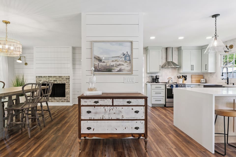 Your spacious open-concept kitchen and dining area blend modern comfort with coastal charm, perfect for cooking memorable meals together.