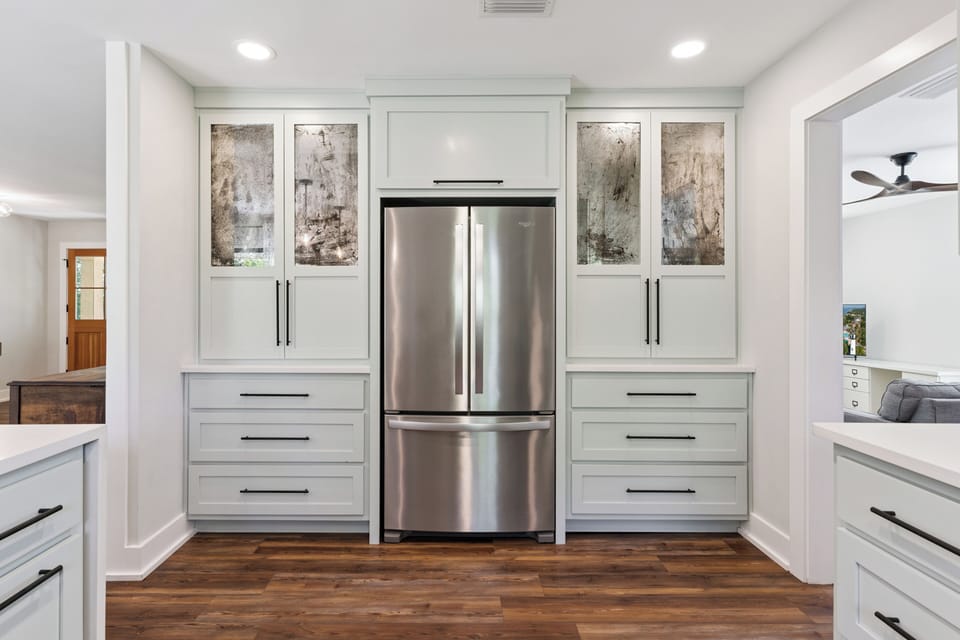 Your gourmet kitchen features sleek stainless steel appliances and custom cabinetry, perfect for creating memorable meals during your stay.