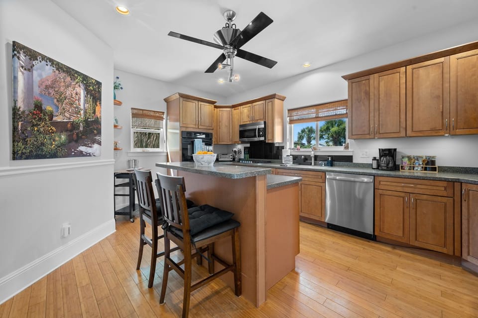 Fully equipped kitchen with island seating for easy meals together.