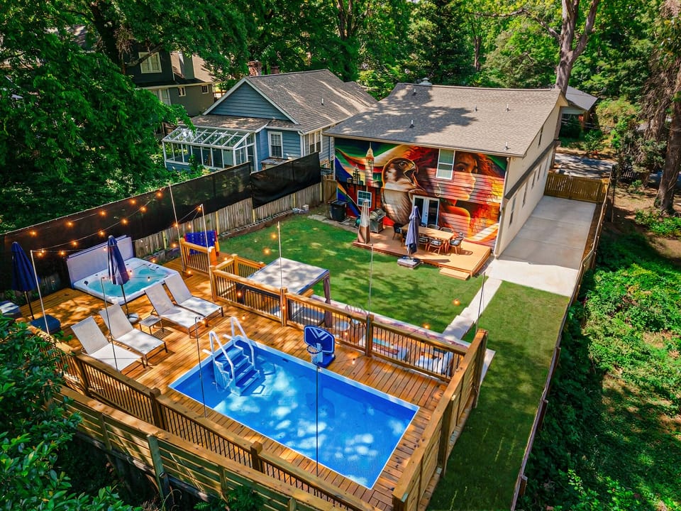 Spacious multi-level backyard with pool, spa, fire pit, and entertainment areas 