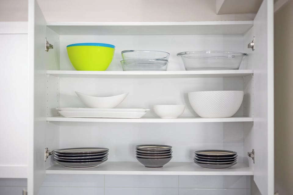 Cupboards packed with cookware, dishes, and essentials so you can feel at home