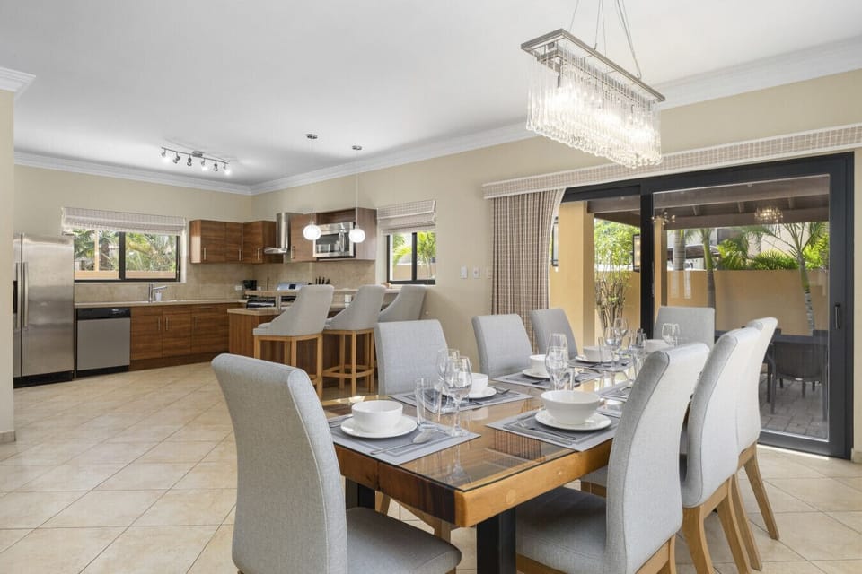 Bright, open-plan kitchen and dining. Features plenty of seating for the whole family and direct access to the outdoor terrace—ideal for easy entertaining.