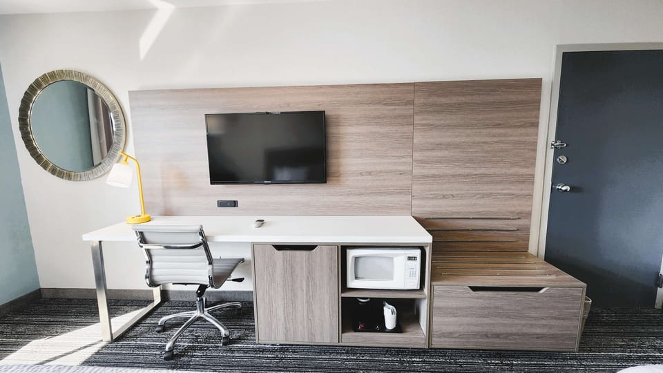 Plug in, focus, and recharge at the bright in-room workstation.
