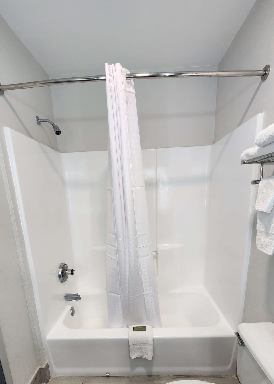 Rinse off and relax in a spotless tub-shower combo.