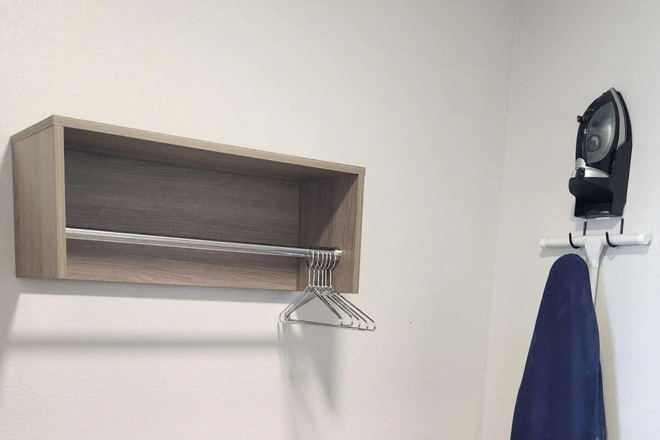 Stay organized with open hanging space and easy ironing access.