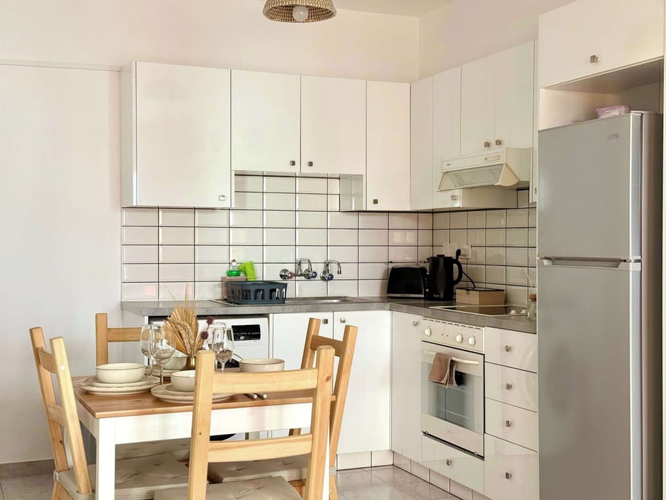 Brew coffee, move seamlessly into the open kitchen, and enjoy meals at the dining table.
