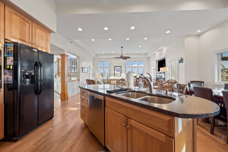 Spacious kitchen island with double sink—perfect for meal prep while staying connected with the group