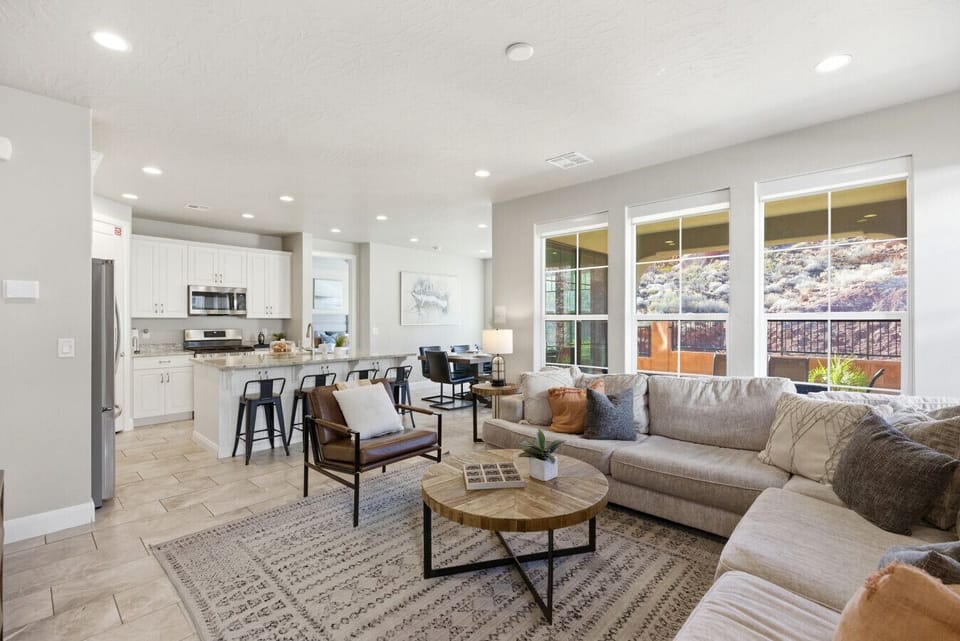 Living Room: Bright and airy space with stunning views, perfect for relaxation and socializing!