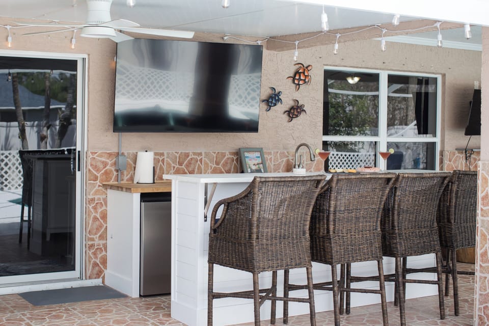 outdoor patio bar with big screen tv