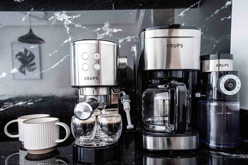 Cappuccino machine, drip coffee maker, burr coffee grinder, espresso cups and coffee mugs