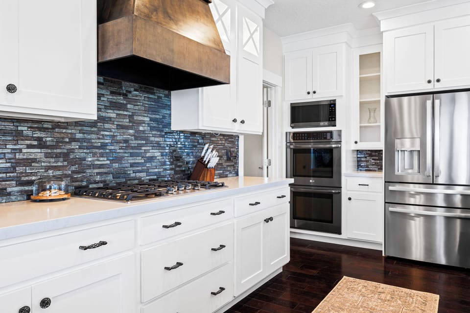 Kitchen: stove, dual ovens, and oversized refrigerator/freezer