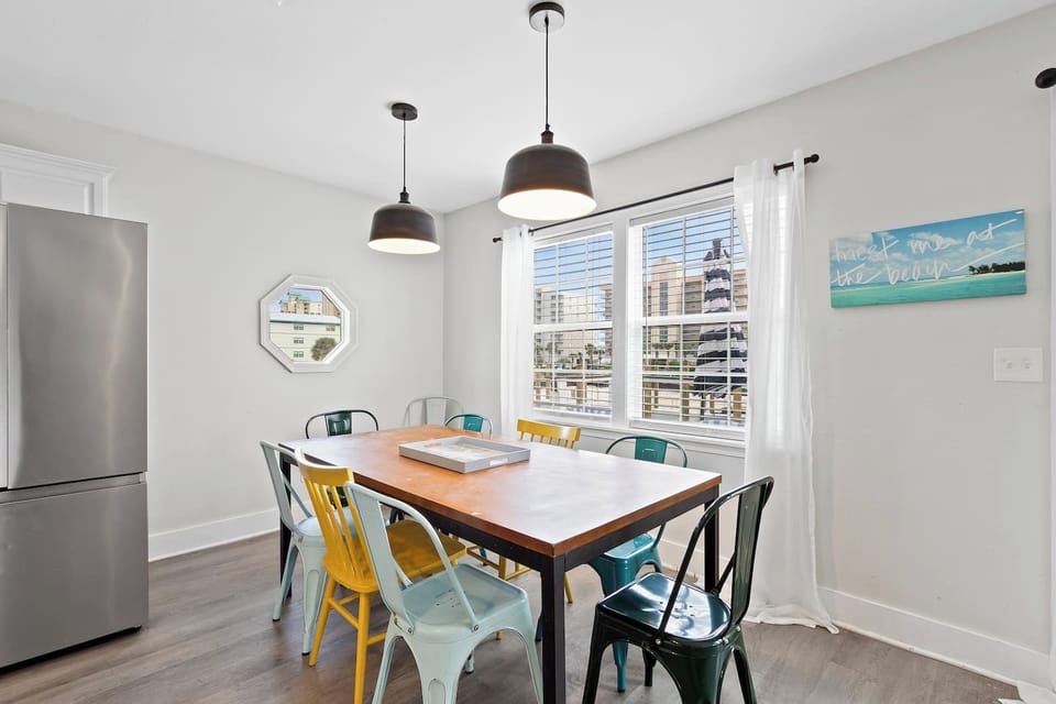 Sunny dining nook with marina views, seating for 6–8, chic pendant lights