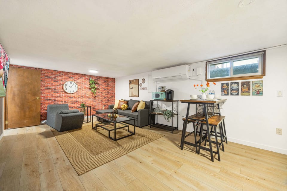 Open-concept living area with a cozy lounge, dining nook—perfect for relaxing or gathering.