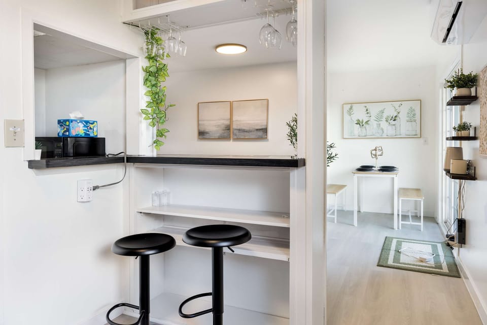 Cozy breakfast bar with seating, perfect for casual meals or morning coffee.