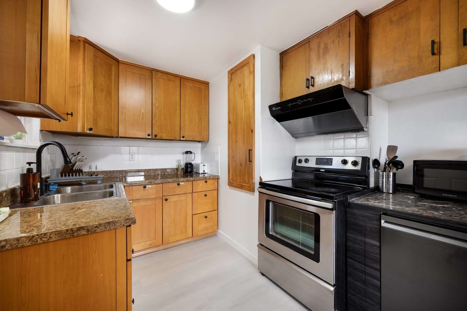 Classic kitchen with warm wood cabinetry and ample counter space.