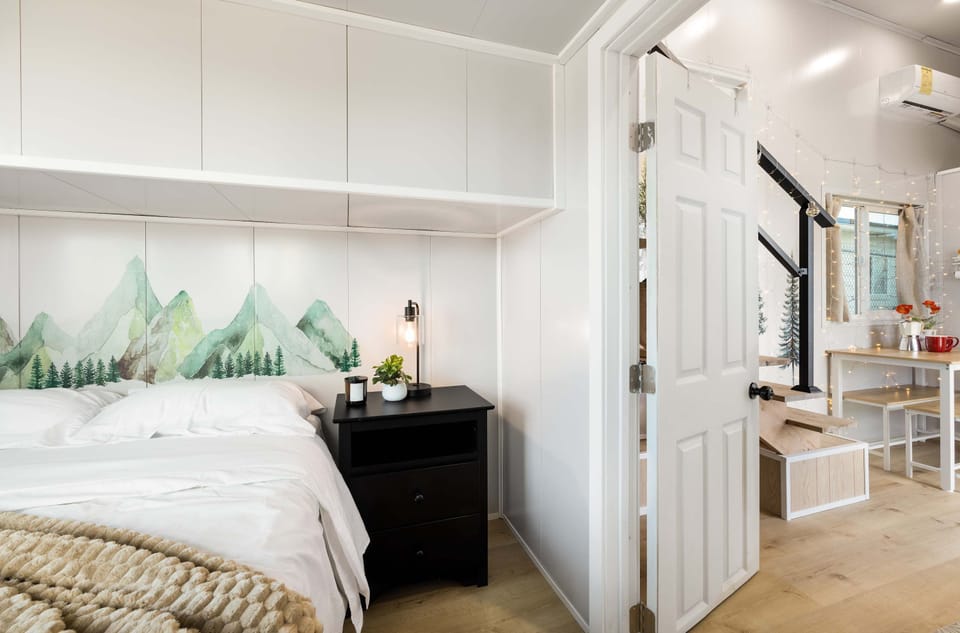 Comfortable bedroom with plush bedding.