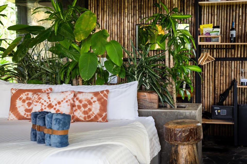 Sink into crisp linens surrounded by lush, calming greenery.