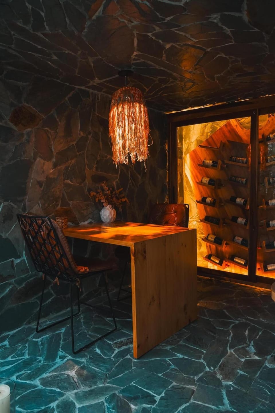 Sip vintage wine in a cozy, stone-walled tasting nook.