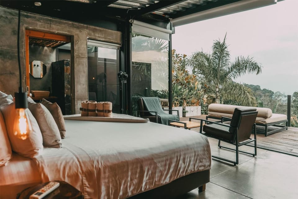 Slide open the doors and lounge with panoramic treetop views.