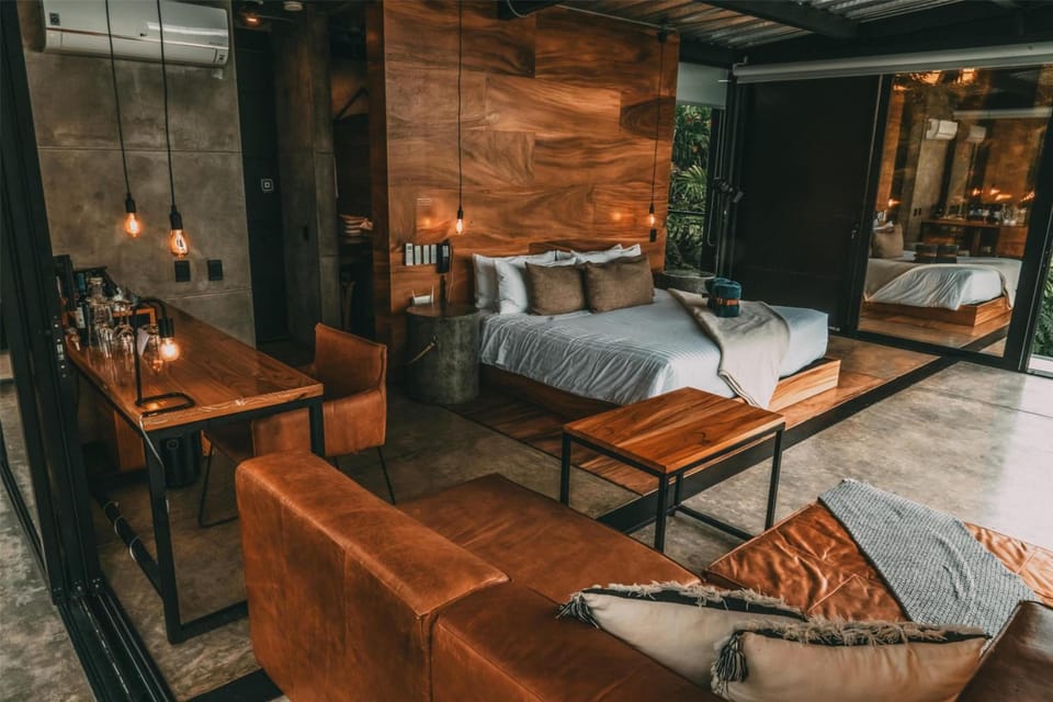 Lounge comfortably in your open-plan suite with soft lighting.