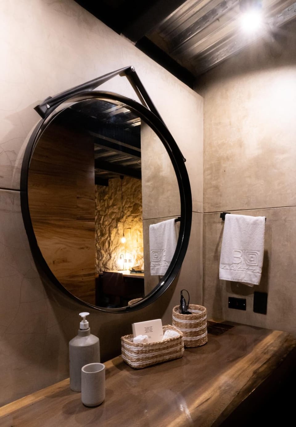 Refresh at the spa-style vanity with warm, ambient lighting.