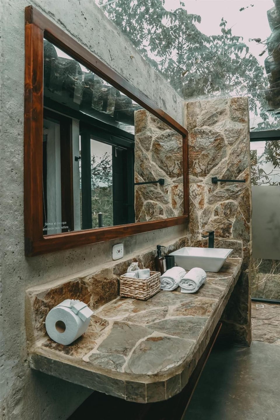 Refresh at the stone vanity with spa-like open-air serenity.