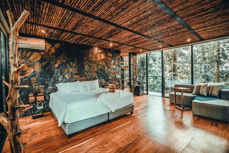 Stretch out in a sunlit suite wrapped in floor-to-ceiling glass.