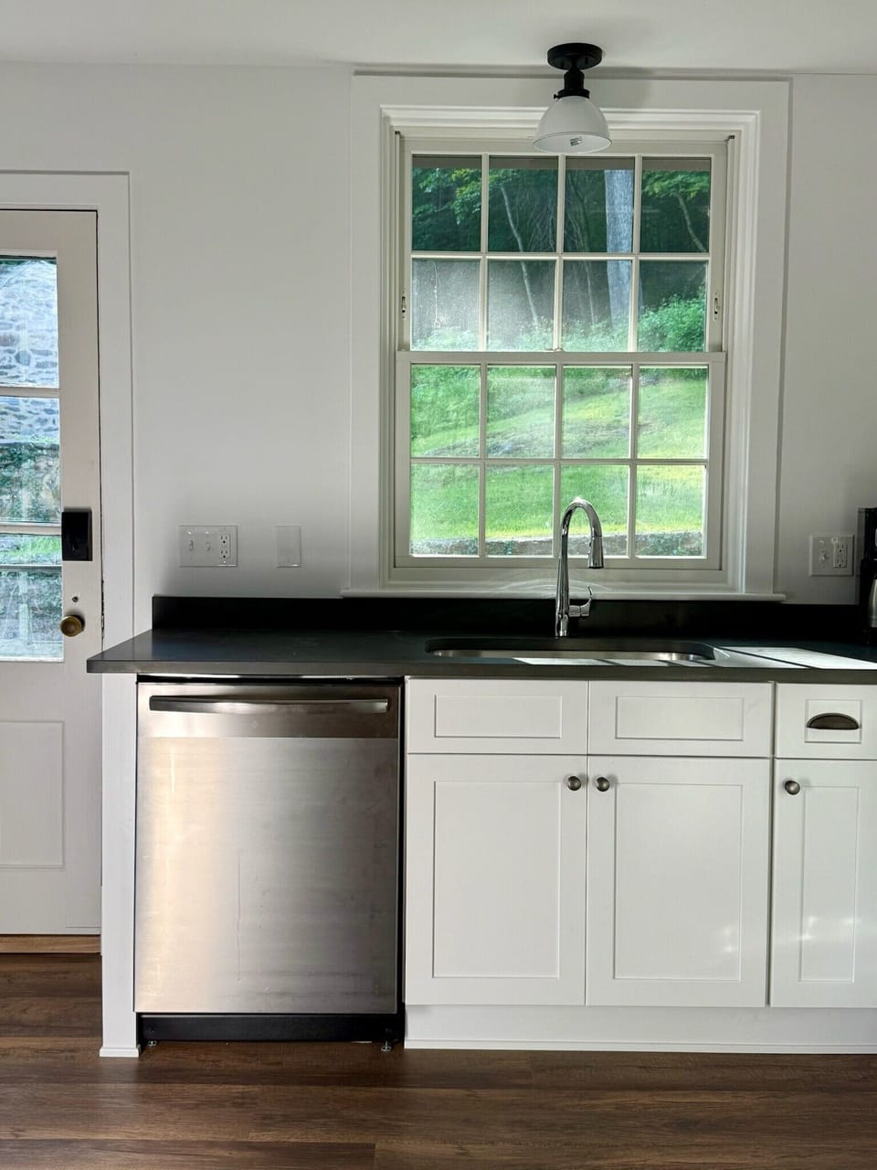 The kitchen was recently renovated, has a dishwasher, and opens onto the patio.