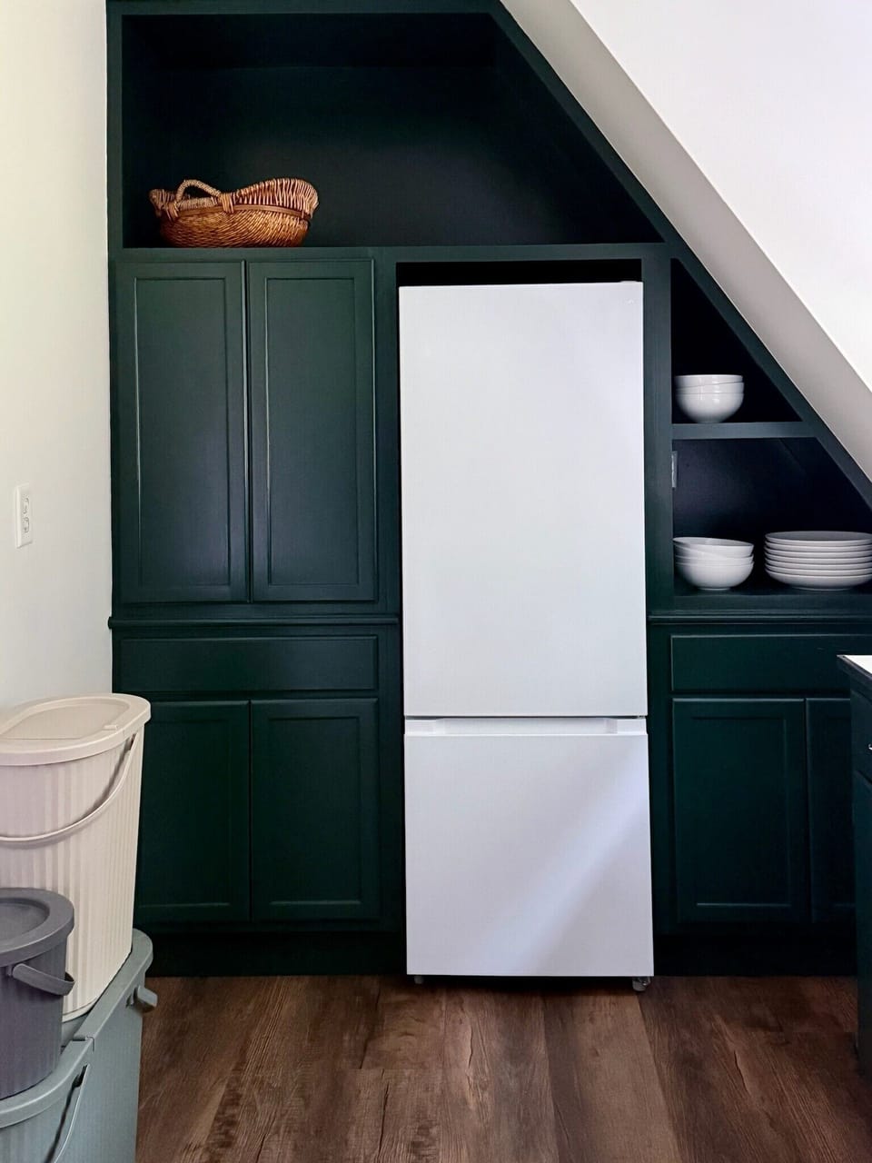The kitchenette contains a small refrigerator and freezer for snacks.
