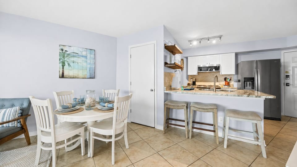 Bright dining nook connected to the modern coastal kitchen.