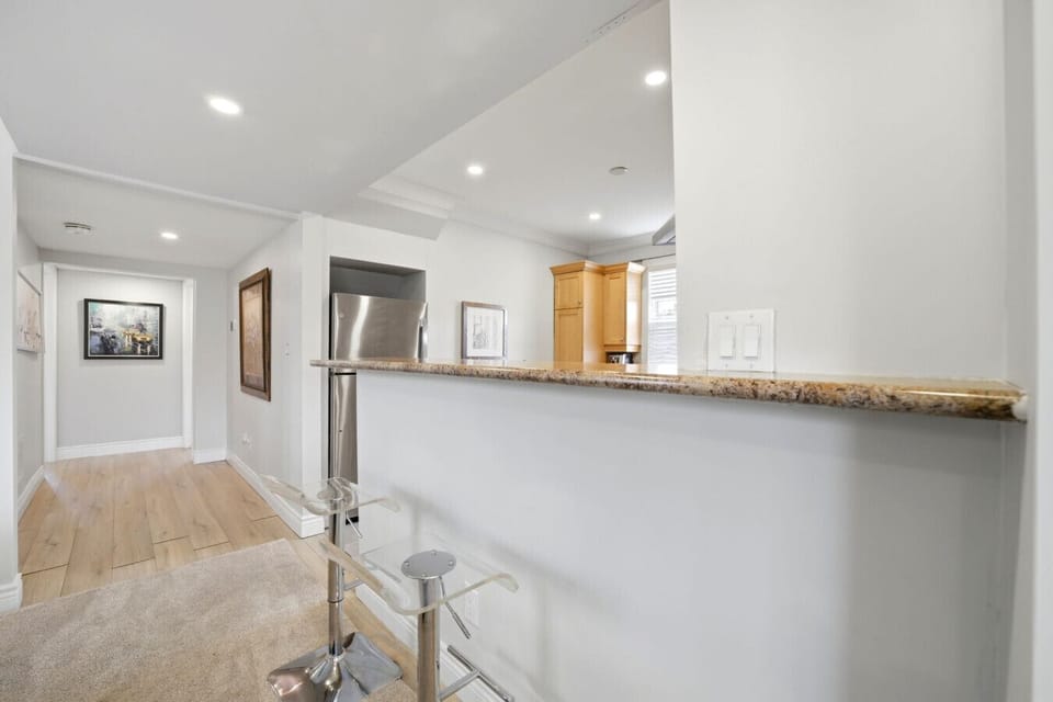 Enjoy a sleek and social layout designed for easy transitions between spaces. This modern setting offers a sophisticated atmosphere for morning coffee or evening conversation, ensuring you feel right at home from the moment you arrive.