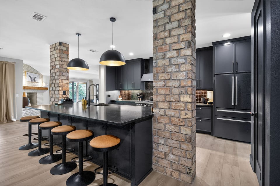 The chef's kitchen features a spacious island with seating for six, making it the perfect place to cook together, enjoy appetizers, or gather before dinner.