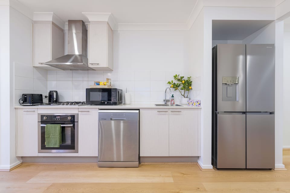 Bright modern kitchen with full-size appliances and sleek finishes