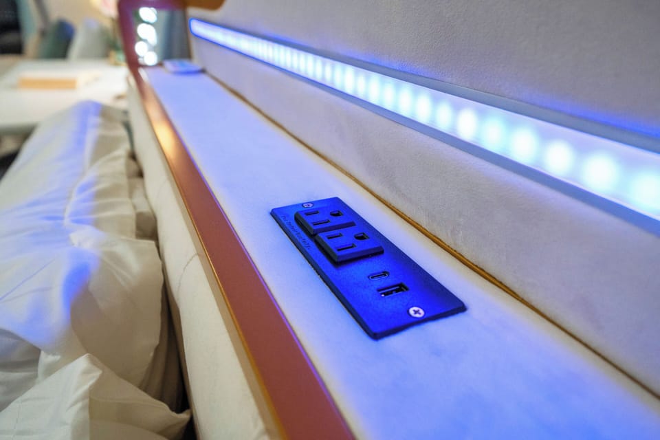 Stay connected and charged with a bedside power outlet.