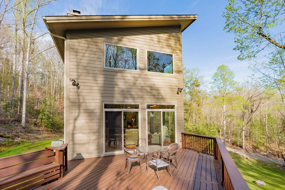 Relax on the spacious deck in your own private forest hideaway.