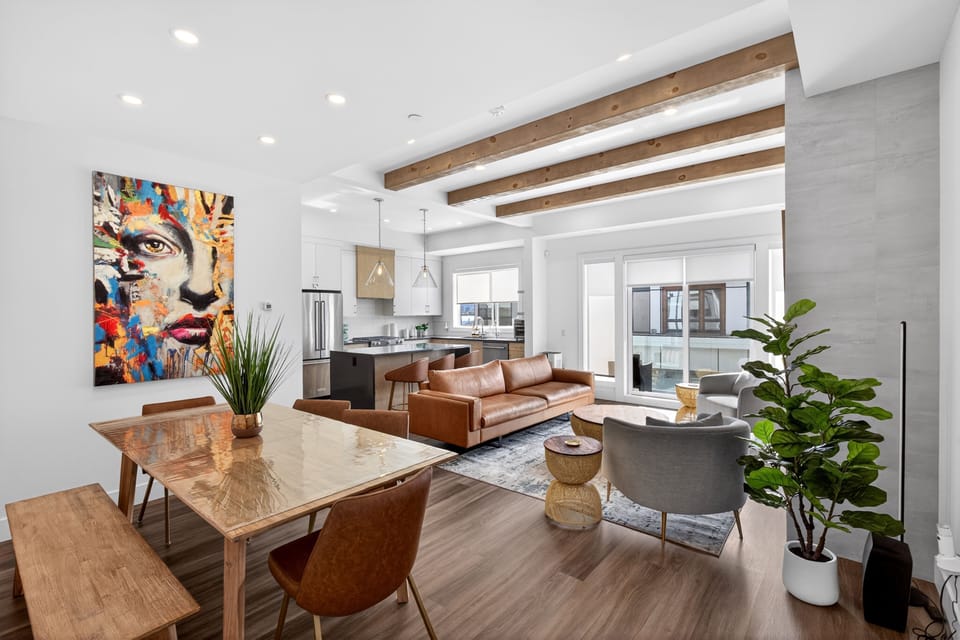 A striking modern exterior welcomes you with clean lines, warm wood accents, & upscale curb appeal.