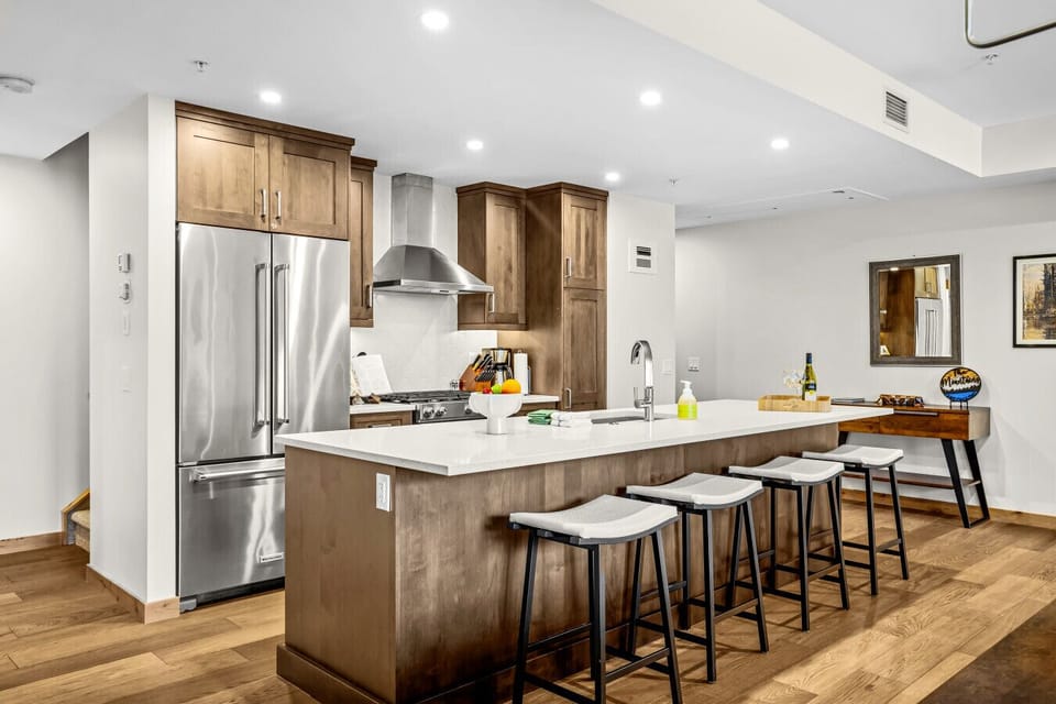 Open kitchen area with bar seating.