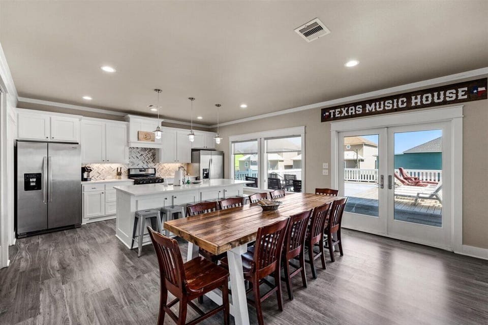 Spacious dining area with large table for group meals, perfect for family gatherings in Crystal Beach Texas