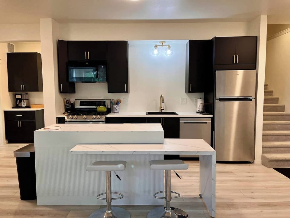 Kitchen features stainless appliances including a dishwasher